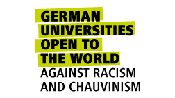 "German Universities Open to the World Against Racism and Chauvinism." The image conveys a message of inclusivity and opposition to racism and chauvinism in German universities, emphasizing their openness to the world.
