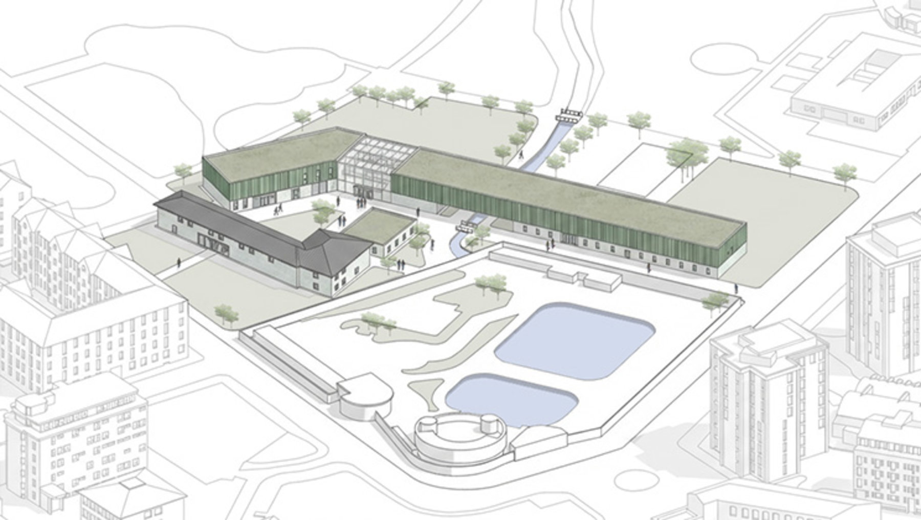 Großes Schulgebäude mit langem, flachem Haupttrakt und seitlichem Anbau, umgeben von Sportanlagen wie einem Schwimmbecken und einem Rundkurs, mit angrenzendem Grünbereich und wenigen Bäumen. Im Hintergrund Wohnhäuser und ein Hochhaus.